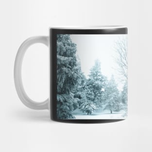 Snow and frost covered pine trees Mug